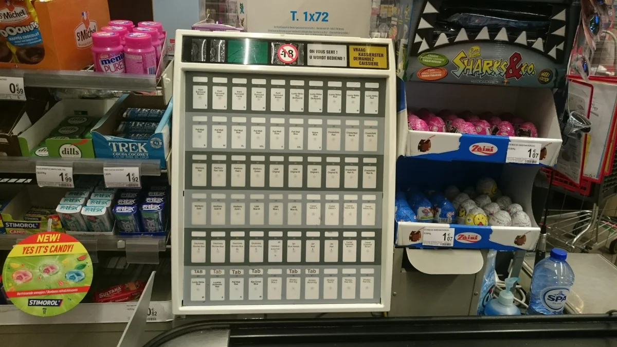 Cigarette packages displayed behind a retail counter