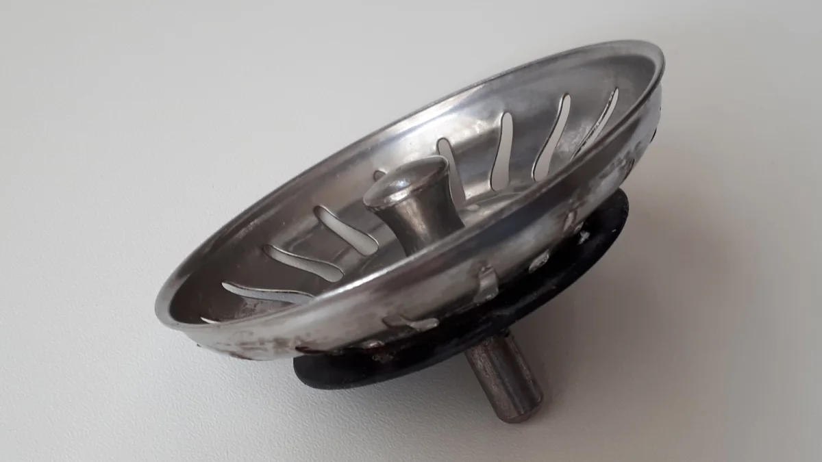Clean stainless steel sink surface and drain strainer